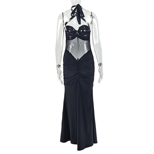 Detailed back view of a black backless maxi dress with mesh panels and halter neck design