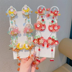 Detailed view of Chinese Hanfu hair clips with rabbit charms and long colorful tassels