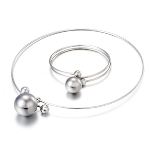 Polished silver stainless steel jewelry set featuring a choker and bangle with hollow spheres