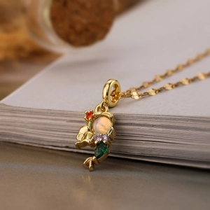 Gold plated fairytale princess necklace with opal and colorful zircon on book pages