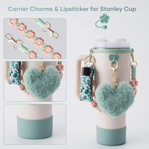 Detail showing woven flower strap, plush heart charm, and cactus lipstick sleeve set
