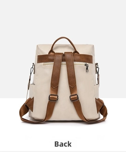 Back view of minimalist two-tone backpack featuring anti-theft zipper and adjustable straps