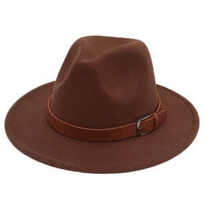 Detail of the dark brown felt fedora featuring a classic leather belt strap and metal buckle