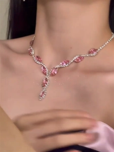 Detail of a pink marquise crystal Y-shaped necklace on model with silver-tone setting