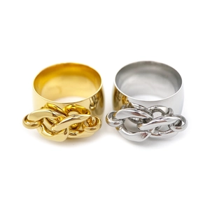 Detailed view of gold and silver wide band rings with chain link texture decoration