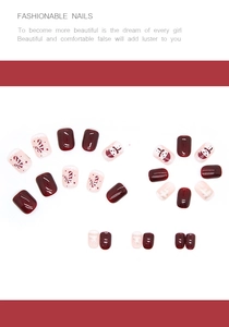 Detail of short wine red Christmas press-on nails with snowman and candy cane art
