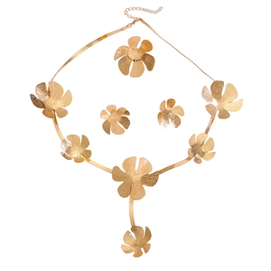 Luxurious gold flower jewelry set featuring a detailed floral necklace and matching earrings