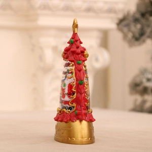 Detail of Christmas tree water globe featuring Santa Claus and swirling snow glitter