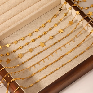 Gold stainless steel necklace set featuring star pendants and flat snake chain detail