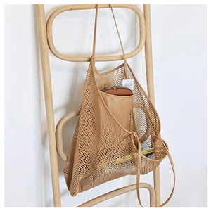Minimalist mesh beach tote bag in khaki with matching inner pouch on a wooden hanger