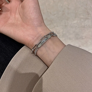 Silver double-layered bracelet with paperclip and Cuban links and Good Luck pendant