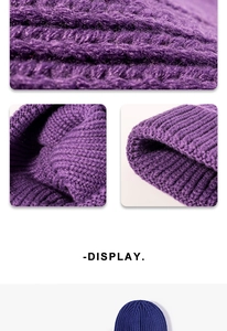 Detail view of thick knit texture and seams on purple and dark blue warm winter beanies