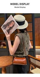 Stylish brown leather cylindrical shoulder bag for women, perfect for daily fashion and casual wear.