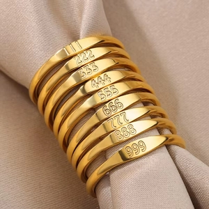 Polished gold stainless steel angel number ring set featuring numeric 111-999 engravings