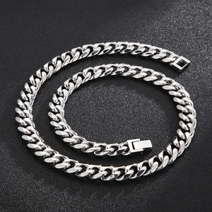 Polished silver stainless steel 10mm Cuban link chain necklace for men on black background