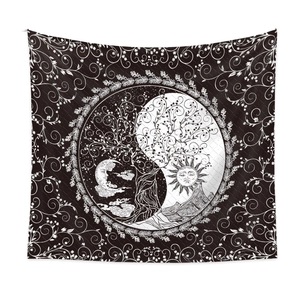 Detail of bohemian black and white tapestry with tree of life and mandala patterns