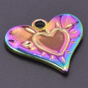 Macro shot of iridescent heart-shaped stainless steel pendant with 18k plating