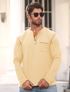 Detail of light beige men's long sleeve Henley T-shirt with chest pocket in outdoor setting