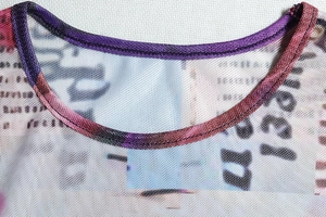 Close-up of the sheer mesh round neck detail with premium stitching and artistic prints