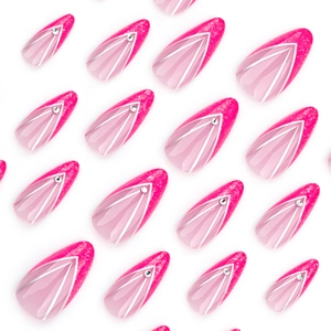 Pink and magenta almond press-on nails with silver V-shaped lines and glitter