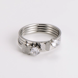 Close-up of butterfly ring with shimmering diamonds and layered metal texture details