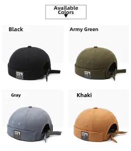 Detail of docker caps in black, army green, grey, and khaki with adjustable metal buckle strap