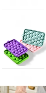 Macro detail of multi-color silicone ice cube trays for 33 mini round balls