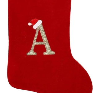 Red velvet Christmas stocking featuring a golden embroidered letter A with Santa hat