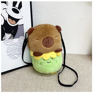Close-up of soft brown capybara plush bag with green base and detailed velvet texture