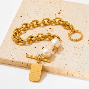 Golden baroque pearl bracelet with square tag and toggle clasp for banquet party wear
