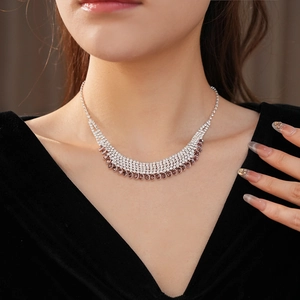 Detailed macro of multi-layer rhinestone fringe necklace with champagne gemstones