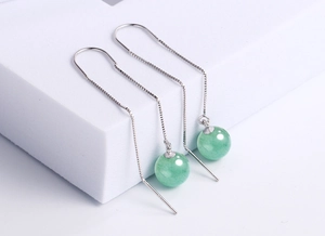 Close-up of S925 silver thread earrings with polished green aventurine jade beads