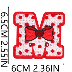 Detailed embroidery texture of Red M letter patch with bowknot and sizing dimensions