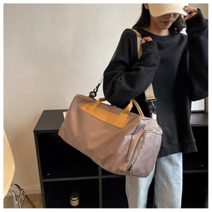 Khaki large yoga gym bag with waterproof nylon texture and yellow leather handles