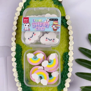 Rainbow and cloud shaped erasers in transparent box on decorative green tray