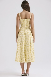 Back view of summer floral midi dress featuring backless cut and thin spaghetti straps