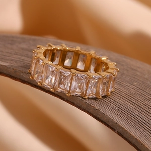 Detailed close-up of 18K gold plated ring with full eternity square-cut zircon stones