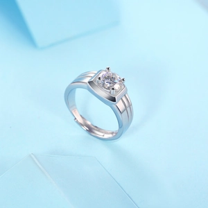 Macro shot of silver sterling ring with a round moissanite stone and thick band detail
