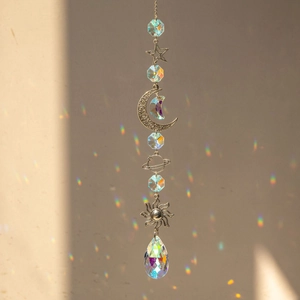 Silver celestial suncatcher with galaxy planet moon star prism casting rainbow light
