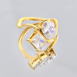 Golden titanium steel ring with teardrop and square diamonds on a wavy band