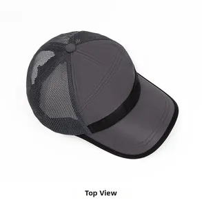 Top down view of quick dry mesh trucker hat in dark grey with breathable fabric details