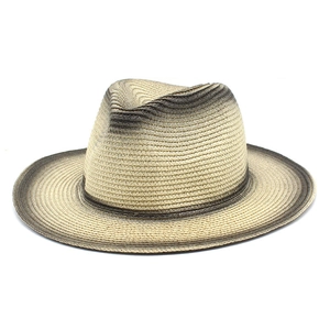 Detail view of woven straw fedora hat featuring a stylish grey gradient transition