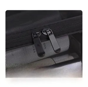 Detail of smooth double metal zippers on a black mesh multipurpose cosmetic storage bag