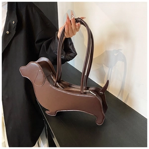 Detailed view of brown dachshund shaped leather tote bag with top zipper and stitching