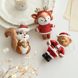 Glittery Christmas ornaments featuring squirrel, deer and bear shapes for tree decor