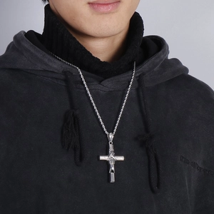 Retro stainless steel cross pendant necklace with wire wrap and functional whistle on male model