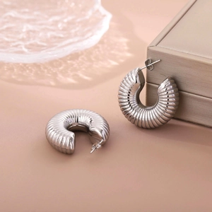 Chic hollow thread titanium steel horn earrings in silver finish for women fashion
