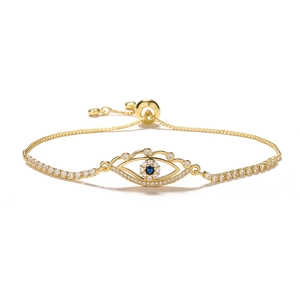 Adjustable golden evil eye bracelet with blue and white cubic zirconia accents
