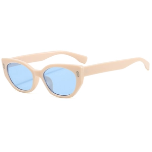 Cat eye sunglasses in beige with light blue lenses and metallic rivet accents