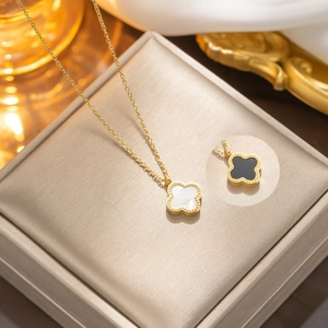 Gold stainless steel clover jewelry set with white shell and black agate inlays